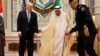 FILE - U.S. President Donald Trump, left, stands with Saudi King Salman as he is helped by his bodyguard during a photo with leaders at the Gulf Cooperation Council meeting, in Riyadh, Saudi Arabia, May 21, 2017.