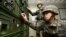South Korean army soldiers adjust equipment used for propaganda broadcasts near the border area between South Korea and North Korea in Yeoncheon, South Korea, Friday, Jan. 8, 2016.