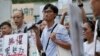 Land reform campaigner Eddie Chu, center, speaks as he thanks his supporters for their vote in the legislative elections in Hong Kong, Sept. 10, 2016.