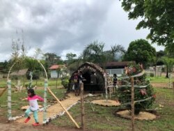 FILE - A Christmas display is seen in a village near the Colombian border outside Puerto Ayacucho, Amazonas, Venezuela, Dec. 1, 2020.