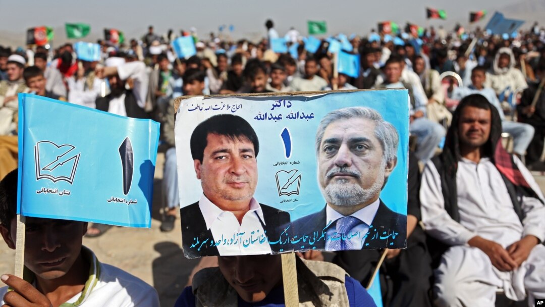 Supporters of Afghan presidential candidate Abdullah Abdullah attend a campaign rally in the Paghman district of Kabul, Afghanistan, June 9, 2014.