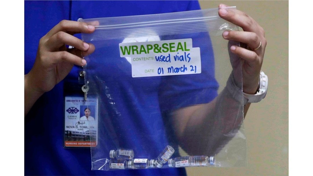 Used vials of China's Sinovac vaccine are shown during the first batch of vaccination at the Lung Center of the Philippines in Quezon city, Philippines on March 1, 2021.
