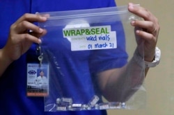 Used vials of China's Sinovac vaccine are shown during the first batch of vaccination at the Lung Center of the Philippines in Quezon city, Philippines on March 1, 2021.