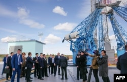 In this pool photo distributed by Sputnik agency, Russia's President Vladimir Putin (centre L) and North Korea's leader Kim Jong Un (centre R) visit the Vostochny Cosmodrome in Amur region on September 13, 2023. (Photo by Mikhail Metzel / POOL / AFP)
