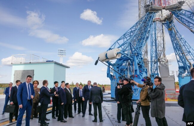 In this pool photo distributed by Sputnik agency, Russia's President Vladimir Putin (centre L) and North Korea's leader Kim Jong Un (centre R) visit the Vostochny Cosmodrome in Amur region on September 13, 2023. (Photo by Mikhail Metzel / POOL / AFP)