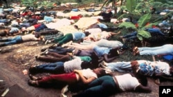 Bodies of members of the People's Temple lwho committed suicide under the direction of cult leader Jim Jones lay strewn around the group's compound in Jonestown, Guyana in 1978.