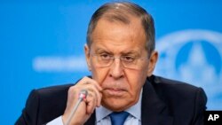 Russia's acting Foreign Minister Sergey Lavrov listens for a journalist's question during his annual roundup news conference summing up his ministry's work in 2019, in Moscow, Russia, Jan. 17, 2020.