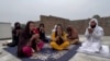 A Muslim cleric and transgender persons attend a prayer ceremony for two transgender women who were killed by two men armed with daggers at their home in Mardan, a city in Pakistan's Khyber Pakhtunkhwa province, Oct. 22, 2024.