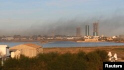 Smoke rises after an airstrike hit Maitiga airport in Tripoli, Libya, March 5, 2015.