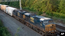 FILE - A CSX freight train travels through Alexandria, Virginia, on Sept. 15, 2022.