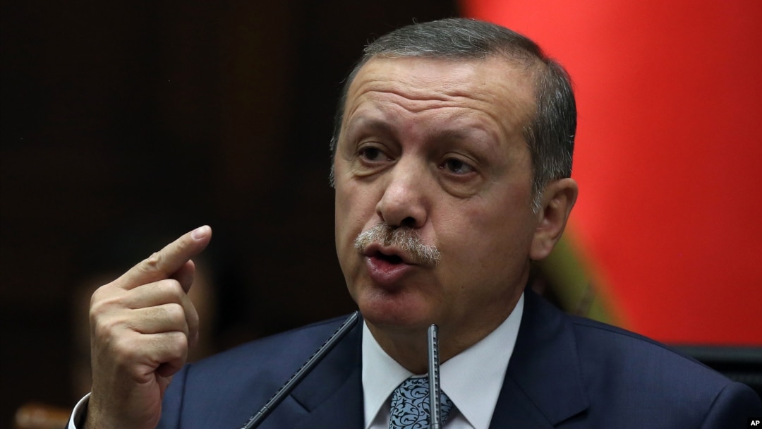 Turkish Prime Minister Recep Tayyip Erdogan addresses his lawmakers in Ankara, Feb. 25, 2014.