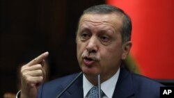 Turkish Prime Minister Recep Tayyip Erdogan addresses his lawmakers in Ankara, Feb. 25, 2014.