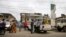 People queue with their vehicles to buy fuel at a fuel station in Agege district in Lagos, Nigeria, April 5, 2016. 