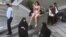 This image grab from a UGC video posted on Nov. 2, 2024, and widely shared on social media shows a female student in her underwear outside Tehran's Islamic Azad University.