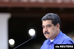 FILE - Venezuela's President Nicolas Maduro speaks during an event with the youth of Venezuela's United Socialist Party in Caracas, Venezuela, June 22, 2020.