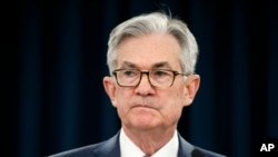 FILE - In this March 3, 2020 file photo, Federal Reserve Chair Jerome Powell pauses during a news conference in Washington.