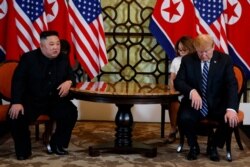 FILE - President Donald Trump meets North Korean leader Kim Jong Un in Hanoi., Feb. 28, 2019.