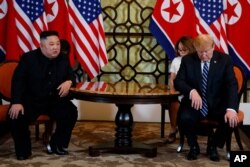 FILE - President Donald Trump meets North Korean leader Kim Jong Un in Hanoi., Feb. 28, 2019.