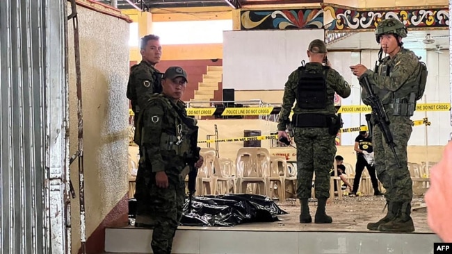 FILE - Philippines ilitary personnel at the site of a bomb attack on Dec. 3, 2023. Khadafi Mimbesa, alleged to be the mastermind of the bombing, died after a clash with troops in January 2024, the military confirmed on Feb. 12, 2024.