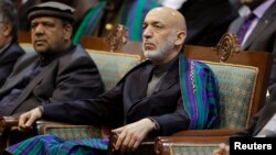 Afghan President Hamid Karzai attends the last day of the Loya Jirga, in Kabul, Nov. 24, 2013. 