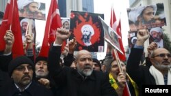 Shi'ite protesters carry posters of Sheikh Nimr al-Nimr during a demonstration in front of Saudi Arabia's Consulate in Istanbul, Turkey, Jan. 3, 2016. 