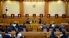 FILE - South Korean acting Constitutional Court's Chief Judge Lee Jung-mi (center) and seven judges during final ruling of President Park Geun-hye's impeachment at the Constitutional Court in Seoul, South Korea, March 10, 2017.