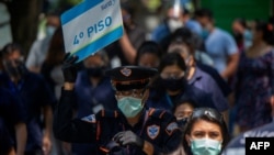 People take part in an earthquake drill, the first since the beginning of the COVID-19 pandemic, in Mexico City on June 21, 2021. 