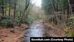 FILE - A heavy rainstorm resulted in a swollen creek in Pennsylvania. 