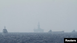 FILE - An oil rig (C) which China calls Haiyang Shiyou 981, and Vietnam refers to as Hai Duong 981, is seen in the South China Sea, off the shore of Vietnam in this May 14, 2014 file photo.