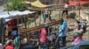 FILE - Residents of the Nazon neighborhood displaced by gang violence construct a tent encampment, in Port-au-Prince, Haiti, Nov. 15, 2024.