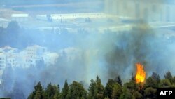 Gambar yang diambil dari Lebanon selatan dekat perbatasan dengan Israel menunjukkan asap mengepul di dekat Kibbutz Israel utara di Kfar Giladi, 30 Oktober 2023. (AFP)