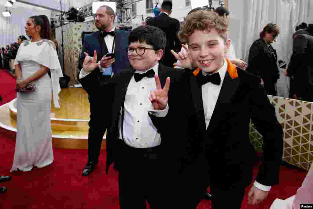 Roman Griffin Davis and Archie Yates pose on the red carpet during the Oscars arrivals at the 92nd Academy Awards in Hollywood, Feb. 9, 2020. 