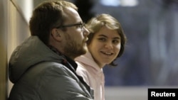 Yekaterina Samutsevich, the member of Pussy Riot who was released from jail after her sentence was suspended on appeal, waits during a court hearing in Moscow November 20, 2012. 