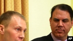 U.S. Army Specialist Mathew Justice (l) and Florida Representative Alan Grayson