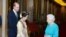 Britain's Queen Elizabeth and the Prince William greet Burma's de facto leader Aung San Suu Kyi 