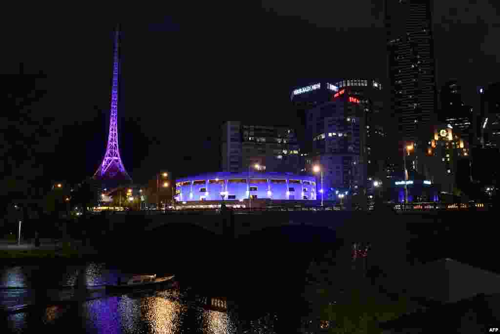 The Victoria Arts Centre is flooded with purple light in tribute to late U.S. music icon Prince in Melbourne, Australia, April 22, 2016. 