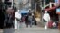 Quarantine workers spray disinfectants at night spots of Itaewon neighborhood, following the coronavirus disease (COVID-19) outbreak, in Seoul, South Korea, May 11, 2020.