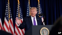 FILE - President Donald Trump speaks during a news conference at his Trump National Golf Club in Bedminster, New Jersey, Aug. 15, 2020.