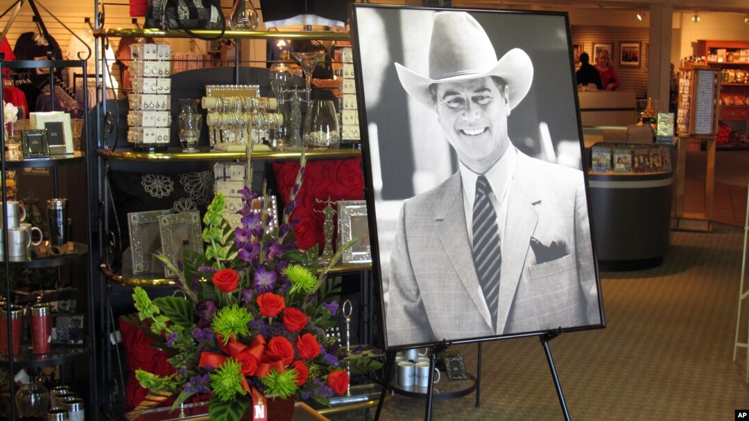 A large portrait of Larry Hagman and a bouquet of flowers are placed at the entrance of the gift shop at Southfork Ranch, where Hagman played the infamous J.R. Ewing for the TV series "Dallas," Parker, Texas, November 24, 2012. 