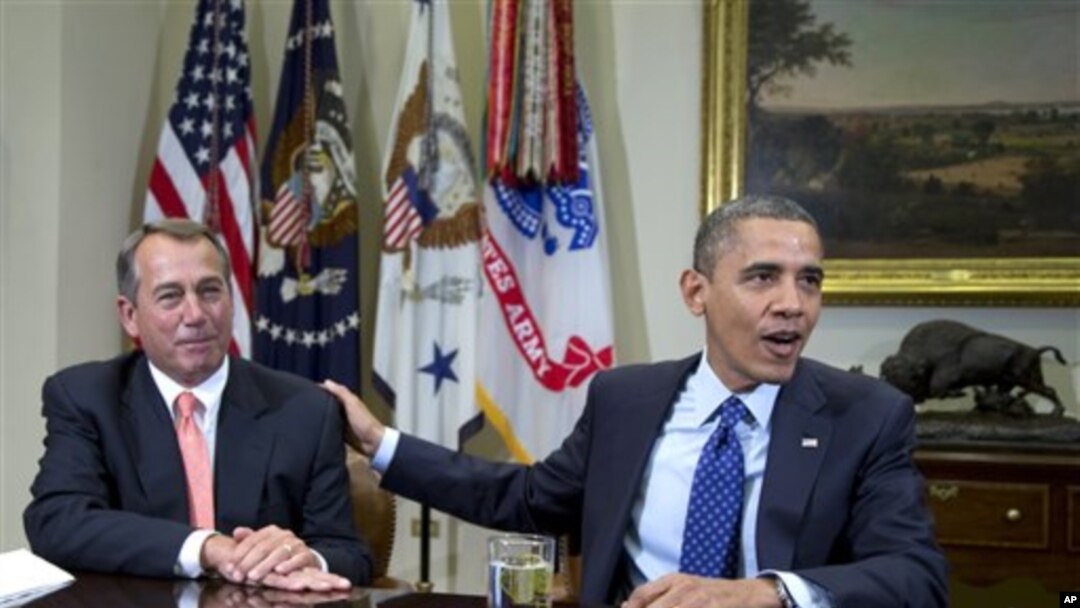 Ketua Kongres John Boehner (kiri) dan Presiden Barack Obama Obama, dua pihak yang harus berkompromi untuk menghindari jurang fiskal. (AP/Carolyn Kaster)