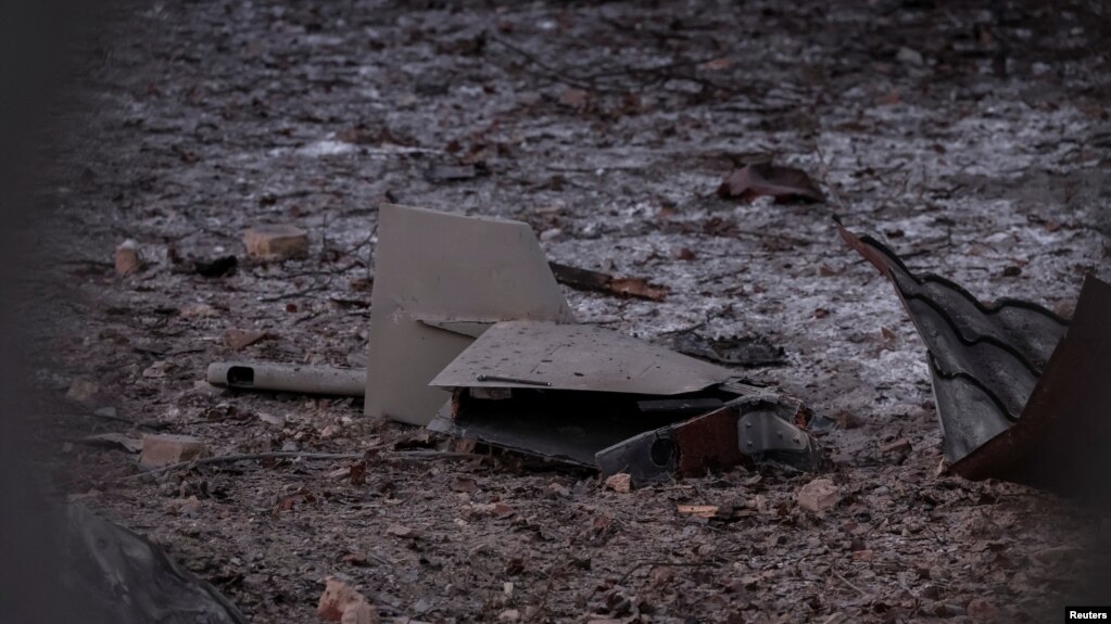 Parts of the drone are seen at the site of a building destroyed by a Russian drone attack, as their attack on Ukraine continues, in Kyiv, Ukraine Dec. 14, 2022. 