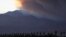 A smoke plume from the Lake Fire in the San Bernardino National Forest is seen at sunset, rising over the Coachella Valley from Palm Springs, California, June 18, 2015. 