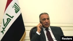 FILE - Iraqi Prime Minister Mustafa al-Kadhimi is pictured at his office in Baghdad, Iraq, May 9, 2020, in this government handout photo.