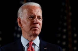 FILE PHOTO: Democratic U.S. presidential candidate and former Vice President Joe Biden speaks about responses to the COVID-19 coronavirus pandemic at an event in Wilmington, Delaware, U.S., March 12, 2020.