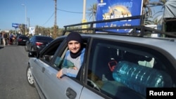 People in heavy traffic drive north from Lebanon's southern coastal city Sidon as some of them flee Israeli bombardment