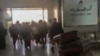 This image from UGC video posted on social media on Dec. 26, 2024, reportedly shows travelers rushing in panic out of Sanaa International Airport after it was hit by an Israeli strike. (UGC via AFP)