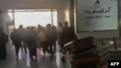 This image from UGC video posted on social media on Dec. 26, 2024, reportedly shows travelers rushing in panic out of Sanaa International Airport after it was hit by an Israeli strike. (UGC via AFP)