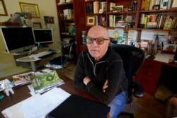 FILE - Dr. Charles Moore is pictured at his home in El Dorado Hills, Calif., Jan. 5, 2021. The retiree volunteered for Gov. Gavin Newsom's California's Health Corps and worked last spring at Sacramento's Sleep Train Arena.