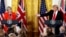 FILE - British Prime Minister Theresa May listens as U.S. President Donald Trump speaks during their joint news conference at the White House in Washington, January 27, 2017.