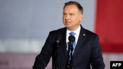 FILE - Polish President Andrzej Duda speaks to a crowd during an event in Gdansk-Westerplatte, Sept. 1, 2020. 